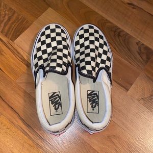 Black checkered slip on vans